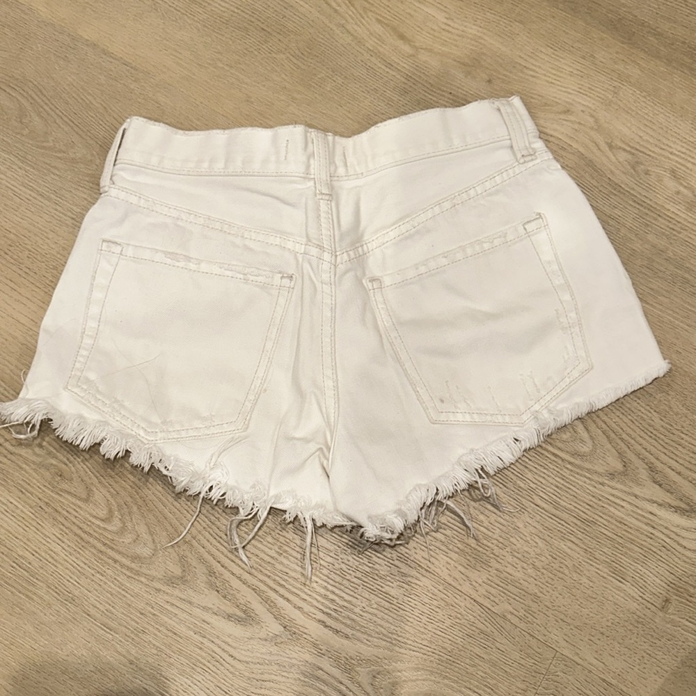WE THE FREE white denim distressed shorts